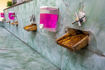 A public outdoors washroom in Thailand, close up.