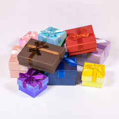 Multi-colored boxes with gifts on a white background.