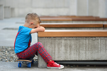 Sad little boy is crying. Child with social problem.