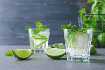 Glass of fresh mojito on table