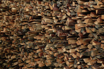 Firewood harvested for the winter. Firewood for the bath folded neatly. Background. Fuel for stove, for bonfire