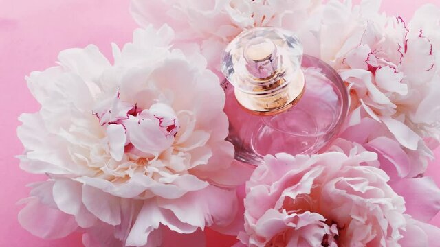 Pink perfume bottle with peony flowers, chic fragrance scent as luxury cosmetic, fashion and beauty product backgrounds