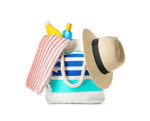 Bag with beach accessories on white background