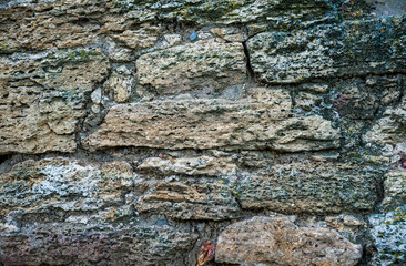 Texture of the old stone wall close-up