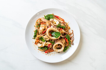 stir fried holy basil with octopus or squid and herb