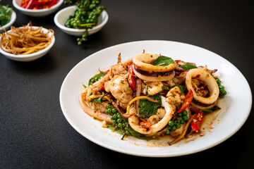 stir fried holy basil with octopus or squid and herb