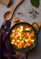 Vegetable soup with cauliflower, laurel and other vegetables