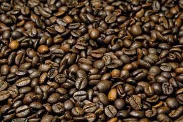 Close-up of brown, roasted coffee beans  background