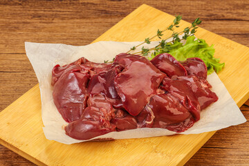 Raw chicken liver over board