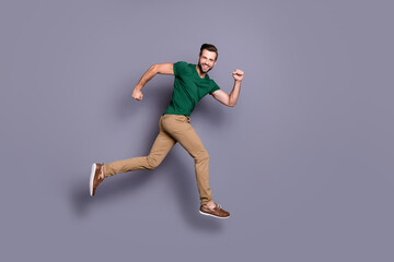 Fototapeta na wymiar Full length profile side photo of excited guy jump run after spring season time discount wear good look clothes footwear isolated over gray color background
