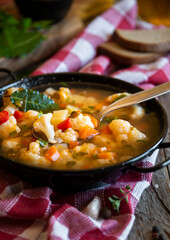 Vegetable soup with cauliflower, laurel and other vegetables