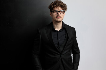 handsome businessman with attitude, standing and posing