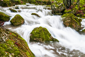 Fototapeta premium Mountain waterfall covered in fog