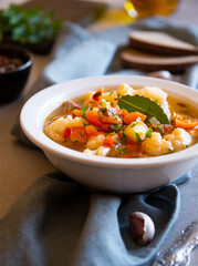 Vegetable soup with cauliflower, laurel and other vegetables