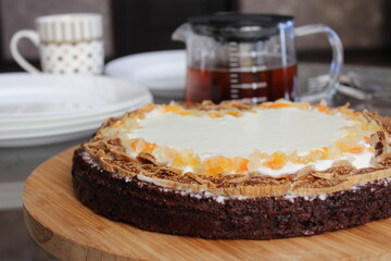 Homemade delicious brownie with cream and dried fruit dates and cantaloupe
