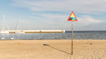 Marina sign on the beach.