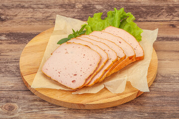 Boiled pork sausage over board