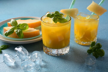 Refreshing drinks and citrus juices  with ice cubes, mint and watermelon. Summer concept 