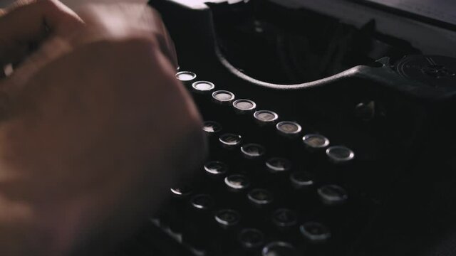 Script writer prints the text on a typewriter
