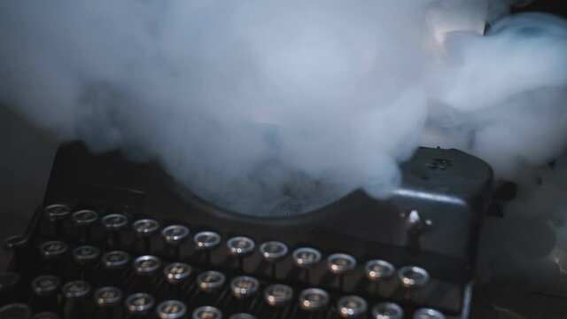 Script writer prints the text on a typewriter