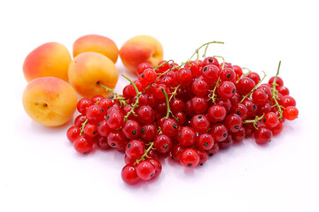 Red currant and apricot berries close-up isolated on a white background