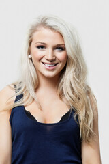 Naklejka premium Attractive blonde woman in studio