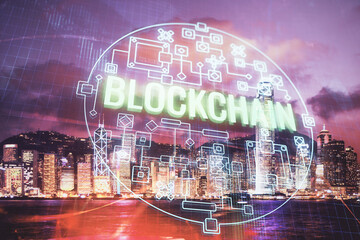 Multi exposure of cryptocurrency theme hologram drawing and city veiw background. Concept of blockchain and bitcoin.