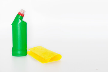 Plastic bottles with chemicals for home cleaning on a white background.