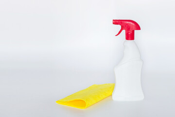 Plastic bottles with chemicals for home cleaning on a white background.