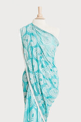 Sari draped on tailor's dummy against gray background