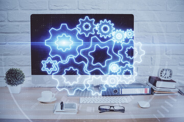 Double exposure of business theme icons and work space with computer background. Concept of success.