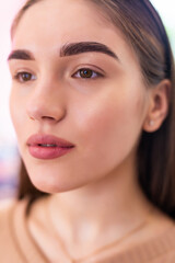 Make-up artist woman eyebrows close up. Professional makeup and cosmetology skin care.