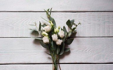 delicate bouquet with white roses and eucalyptus