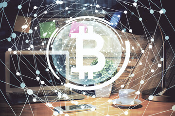 Double exposure of blockchain and crypto economy theme hologram and table with computer background. Concept of bitcoin cryptocurrency.