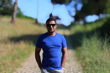 Fototapeta premium portrait of young man of south asian ethnicity wearing sunglasses 