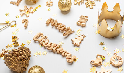 merry Christmas gold  shiny text with luxury xmas decoration items on white table.happy new year holiday concept