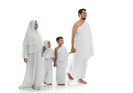muslim hajj family and children walking and hold hand isolated over white background