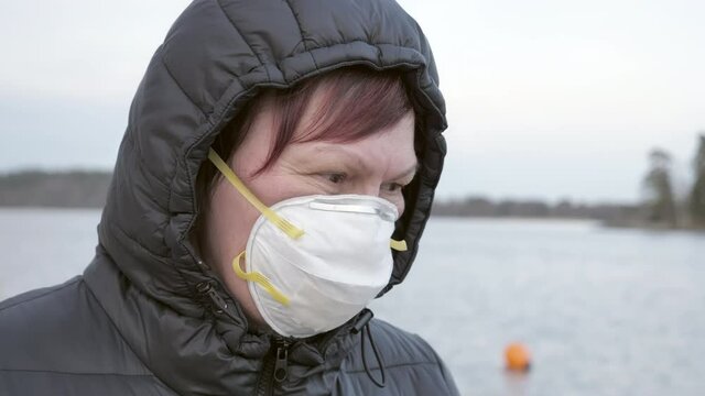 A closer look of the lady wearing a mask in Lake Bodom