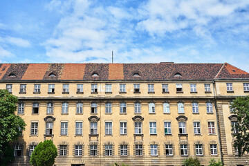Fototapeta na wymiar Facade with windows of historic tenement houses