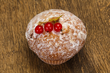 Sweet tasty muffin with red currants