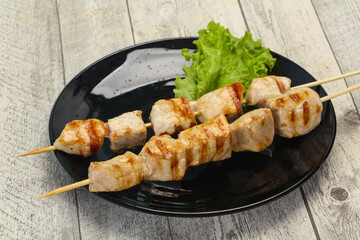 Grilled pork skewer served salad