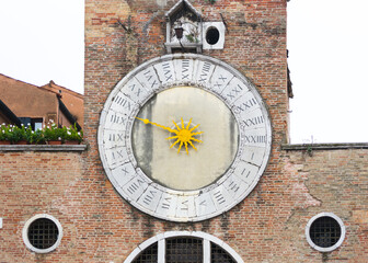 The clock of the "San Giacometto in Rialto" church located in Venice in the San Polo neighborhood closed to the famous bridge. This church is believed to be the oldest in Venice