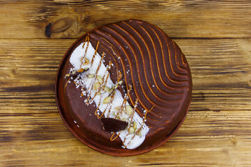 Tasty chocolate cake on a wooden table. Top view