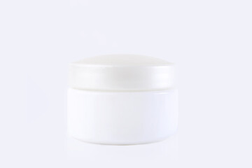 White jar with cream on a white background. Stylish look of the product, mock up.