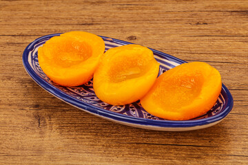 Marinated peaches fruit in the bowl