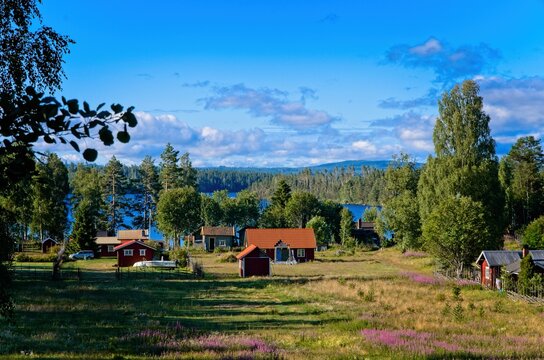 The small village of Dala Floda in rural Dalarna ,surrounded by water and forests on a sunny summer morning.