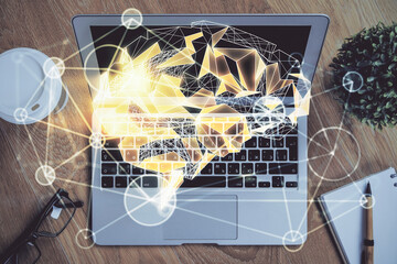 Multi exposure of work table with computer and brain hologram. Brainstorm concept.