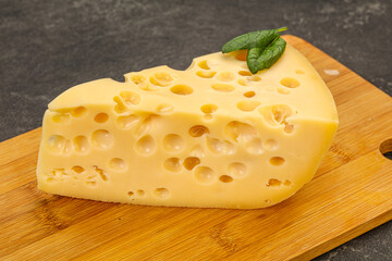 Maasdam cheese - yellow triangle with holes