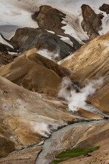 Incredibly colorful and steamy landscape in the geothermal areas of the Kerlingarfjöll mountain range, deep inside the central highlands of Iceland.