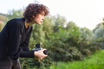 Young woman as a photographer with medium format camera